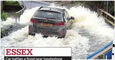  ?? ?? ESSEX
Car battles a flood near Ingateston­e