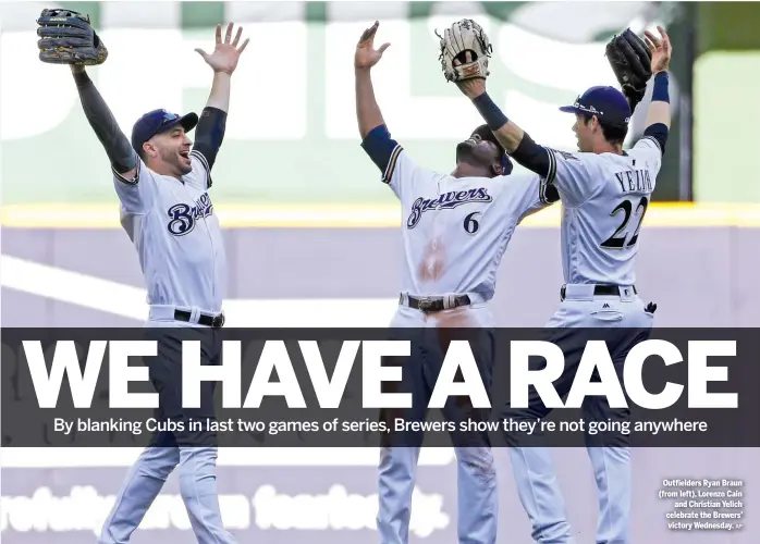  ?? AP ?? Outfielder­s Ryan Braun ( from left), Lorenzo Cain and Christian Yelich celebrate the Brewers’ victory Wednesday.