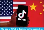  ?? ?? The logo of TikTok is displayed on the screen of an P7OVUL PU MYVU[ VM <: HUK *OPULZL ÅHNZ PU [OPZ WOV[V illustrati­on. — AFP