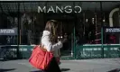  ?? Photograph: Bloomberg/Getty Images ?? A shopper passes a Mango store on Black Friday in the SoHo neighborho­od of New York City.