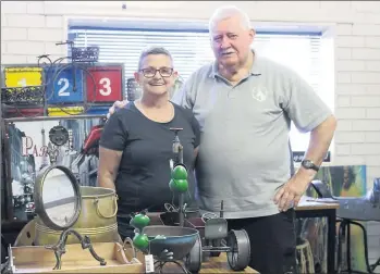  ??  ?? Maz McCallum and Bob Ballantine with some of the auction items.