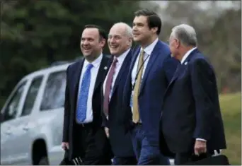  ?? MANUEL BALCE CENETA - THE ASSOCIATED PRESS ?? White House Chief of Staff John Kelly, second from left, with, from left, White House Director of Social Media Dan Scavino, Kelly, White House personnel director Johnny DeStefano, and National Security Council Chief of Staff Keith Kellogg, walk to board Marine One with President Donald Trump on the South Lawn of White House, Friday in Washington.