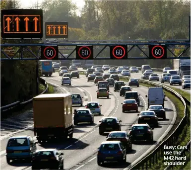  ?? ?? Busy: Cars use the M 2 hard shoulder