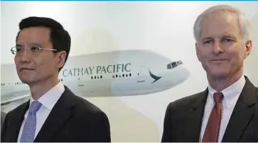  ?? AP PIC ?? Cathay Pacific chairman John Slosar (right) and chief executive officer Ivan Chu at a press conference to announce the carrier’s result in Hong Kong yesterday.