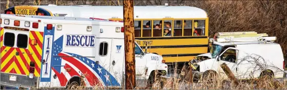 ?? NICK GRAHAM / STAFF ?? A van in Butler County hit an Edgewood Schools bus Dec. 11. One person was taken to a hospital, but the bus’ students, from Seven Mile Elementary, were OK.