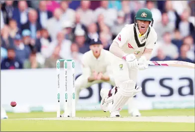  ?? (AP) ?? Australia’s David Warner watches the ball while batting during play on day one of the third Ashes Test cricket match between England
and Australia at Headingley cricket ground in Leeds, England on Aug 22.