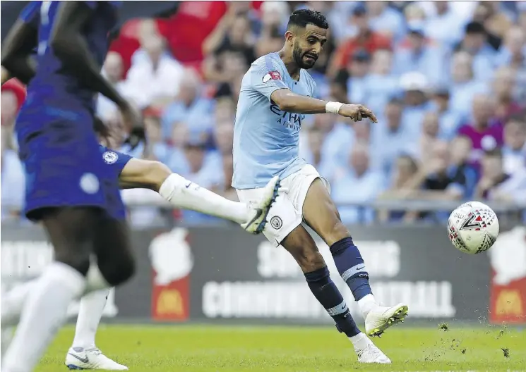  ?? IAN KINGTON/AFP/GETTY IMAGES ?? Defending champion Manchester City may have gotten even better in the off-season with the US$101-million deal for Leicester City’s Riyad Mahrez.