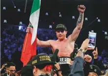  ?? AFP ?? Canelo Alvarez celebrates after defeating Gennady Golovkin by majority decision on Saturday.