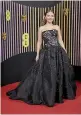  ?? ?? Mia McKenna-Bruce, who won the rising star award, wearing black strapless Carolina Herrera gown.