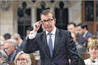  ?? CP PHOTO ?? Treasury Board President Scott Brison stands during question period in the House of Commons on Parliament Hill in Ottawa on Oct. 15, 2018. Brison is quitting a political career he loves to spend more time with a cherished family that politics made possible.