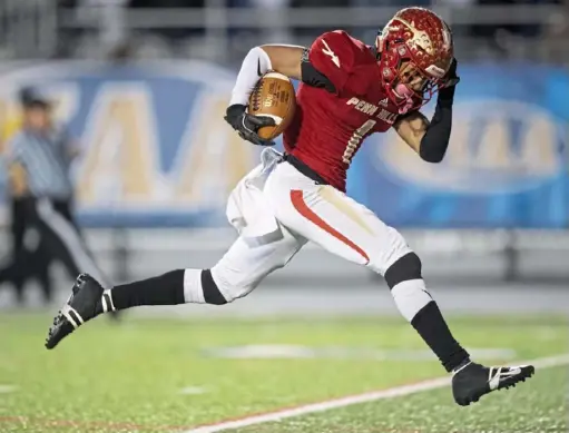  ?? Steph Chambers/Post-Gazette ?? Penn Hills receiver Daequan Hardy scores a touchdown against Manheim Central during the PIAA Class 5A football championsh­ip on Friday, Dec. 7 in Hershey. Penn Hills beat Manheim Central, 36-31, to claim the state title.