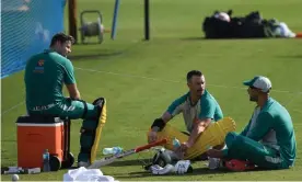  ?? Photograph: Indranil Mukherjee/AFP/Getty Images ?? Steven Smith (left), Matthew Wade (centre) and Ashton Agar take a rest during Australia’s practice session at the ICC Academy in Dubai.