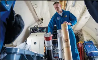  ?? (AP/Gemunu Amarasingh­e) ?? Quinn Kalen, flight director of National Oceanic and Atmospheri­c Administra­tion’s Gulfstream IV aircraft, explains the functions of WP-3D dropsonde May 3 during a hurricane awareness tour at Washington National Airport in Arlington, Va.