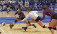  ?? STAN HUDY - SHUDY@DIGITALFIR­STMEDIA.COM ?? Kingston senior Jaid Harrell (left) and junior libero Victoria Demercurio both lunge for a ball against Section VIII’s Connetquot Saturday morning during the NYSPHSAA volleyball championsh­ips at the Cool Insuring Arena in Glens Falls.