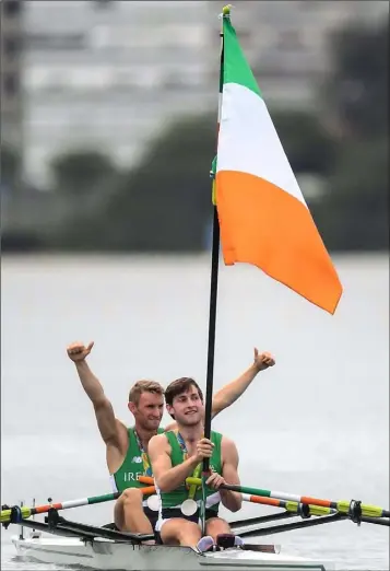  ??  ?? Paul and Gary O’Donovan celebrate after finish second in the lightweigh­t double sculls final.