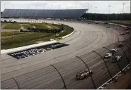  ?? JENNA FRYER — THE ASSOCIATED PRESS ?? Cars go through a turn at Darlington Raceway during the NASCAR Cup Series auto race Sunday in Darlington, S.C.
