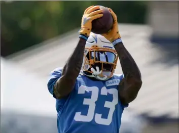  ?? AP Photo/Jae C Hong ?? Los Angeles Chargers safety Derwin James makes a catch during an NFL football camp practice, on Tuesday in Costa Mesa, Calif.