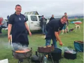  ??  ?? SSC’s site manager Chris Smyth and senior marine operative Ross Fennell served up sizzled salmon.