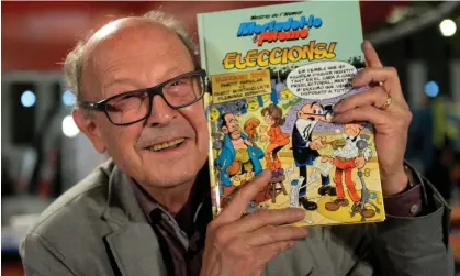  ?? AFP/Getty Images ?? Francisco Ibáñez Talavera poses with one of his Mortadelo y Filemón books at the Barcelona comic fair in 2016. Photograph: Josep Lago/