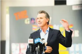  ?? Noah Berger / Special to The Chronicle ?? Gov. Gavin Newsom speaks at a news conference Tuesday at Ruby Bridges Elementary School in Alameda. The district opened schools the day before.