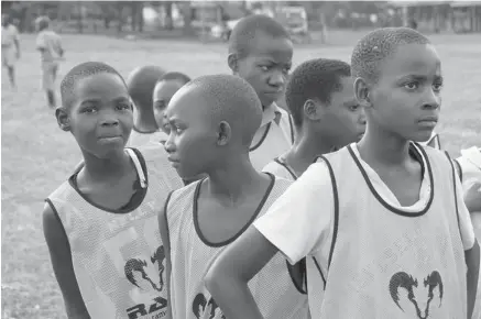  ??  ?? Young boys take part in a skills session in Jinja, Uganda, in early 2013. Bhubesi Pride helps children in Africa play and contribute to communitie­s.