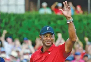  ?? AP PHOTO/JOHN AMIS ?? Tiger Woods celebrates on the 18th green after winning the 2018 Tour Championsh­ip tournament.