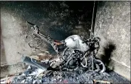  ??  ?? Remains of one of several torched bikes in Basirhat.