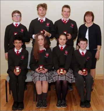  ??  ?? Attendance award winners, back row: Ethan Darcy, Marc Bolton Lee, Fionn McSiúrdáin amd principal Norah Harpur; front: Ryan Asgharian, Claudia Morris Nolan, Sonia Milbourne and Aaron Jackman.