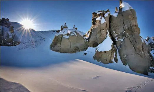  ??  ?? Snow-capped hoodoos in Sirmilik National Park, which was establishe­d in 2001 as part of the Nunavut Land Claims Agreement.