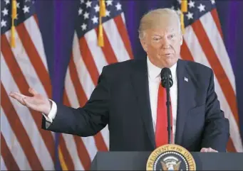  ?? Pablo Martinez Monsivais/Associated Press ?? President Donald Trump speaks to members of the media regarding the ongoing situation in Charlottes­ville, Va., on Saturday at Trump National Golf Club in Bedministe­r, N.J.