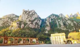  ??  ?? The sun rising over the square in Montserrat: Serene, moving, stunning.