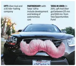  ?? REUTERS ?? A driver with the ride-sharing service Lyft waits for a customer on a street in Santa Monica, California, in a file photo. Lyft allows customers to book rides from a network of screened drivers, who pull up in cars with fluffy pink moustaches attached...