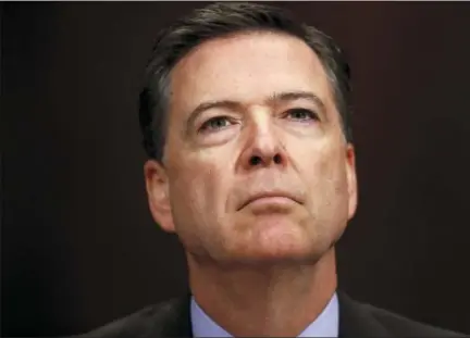  ?? CAROLYN KASTER — THE ASSOCIATED PRESS FILE ?? In this file photo, FBI Director James Comey listens on Capitol Hill in Washington. President Donald Trump has fired Comey. In a statement on Tuesday, Trump says Comey’s firing “will mark a new beginning” for the FBI.