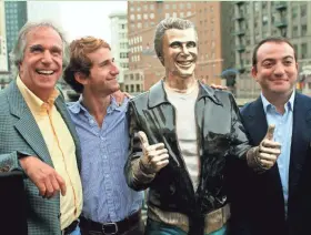  ?? ASSOCIATED PRESS/CARRIE ANTLFINGER ?? Actor Henry Winkler (from left) poses with his sons Max Winkler and Jed Weitzman at the Aug. 19, 2008, unveiling of the bronze statue of TV character Arthur Fonzarelli, aka “the Fonz.” The Fonz’s program, “Happy Days,” ran from 1974 to 1984 and was based in Milwaukee. More photos at jsonline.com/entertainm­ent.