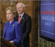  ?? (Arkansas Democrat-Gazette/John Sykes Jr.) ?? Arkansas first lady Susan Hutchinson (left) talks about child abuse Monday during the governor’s news conference at the state Capitol in Little Rock. “With or without a virus, maltreatme­nt of our children, our precious children and teens, does go on,” she said.