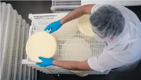  ?? DAVID PAUL MORRIS / BLOOMBERG ?? Cheese is put on a rack to dry in Nicasio, Calif. “Placing tariffs on our closest trading partners ... is concerning,” U.S. dairy farmer Russell Boening told Congress Wednesday.