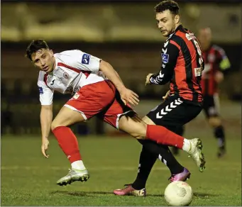  ??  ?? Chris Lyons tussles with Bohemians’ Mark Quigley during his spell with Sligo Rovers.