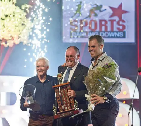  ?? Photo: Kevin Farmer ?? BIG WIN: 2018 Sports Darling Downs Senior Sports Star of the Year winner Matthew Denny (right) is congratula­ted by award sponsors (from left) Kevin Say (Toowoomba Tile Warehouse) and Paul Reedy (K&amp;R Plumbing).
