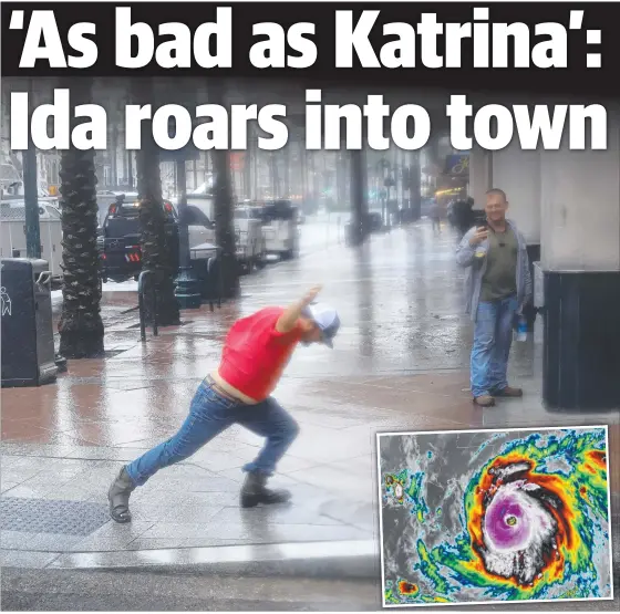  ??  ?? A man in New Orleans struggles to walk as Hurricane Ida (inset) unleashes howling winds and knocks out the city’s entire power grid. Pictures: AFP