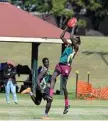  ?? Photo: Kevin Farmer ?? Sibit Mach takes a mark for Centenary Heights State High School in the Darling Downs qualifiers.