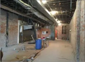  ?? RICHARD PAYERCHIN — THE MORNING JOURNAL ?? Plans are to renovate 882 Broadway and add a new restaurant in the first floor space, which is seen here stripped down to the brick walls.