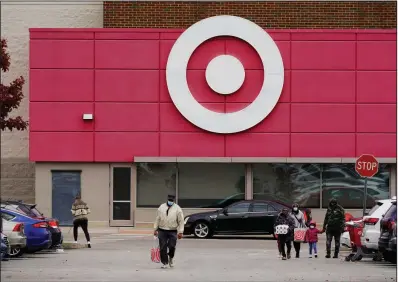  ?? (AP/Matt Rourke) ?? Shoppers navigate the parking lot at a Target store in Philadelph­ia on Nov. 17. Target says having its stores closed on Thanksgivi­ng is the new policy, permanentl­y ending a tradition that it embraced for years.