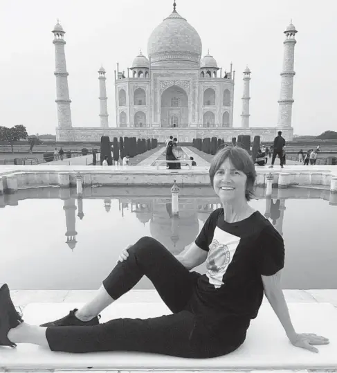  ?? MARY BETH MCCABE ?? Mary Beth Mccabe poses in front of the Taj Mahal in Agra, India. Constructi­on of the vast mausoleum of white marble began in 1632 and finished in 1648.