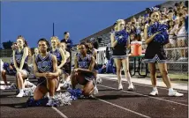  ?? STEPHEN SPILLMAN / FOR AMERICAN-STATESMAN ?? McCallum High School cheerleade­rs kneel during the national anthem before a football game Sept. 29. Readers have different views on protests during the anthem.