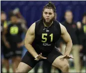  ?? CHARLIE NEIBERGALL — THE ASSOCIATED PRESS ?? Alabama offensive lineman Jedrick Wills runs a drill at the NFL scouting combine Feb. 28 in Indianapol­is.