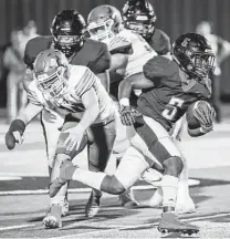  ?? Leslie Plaza Johnson / Contributo­r ?? Dawson’s Bryce Burgess (5) rushed for 91 yards and two touchdowns in the win over Alvin on Friday night.