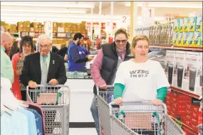  ?? Contribute­d photo ?? Ocean State Job Lot in Litchfield celebrated its grand opening with a ribbon cutting ceremony on March 17. During a Discount Dash scavenger hunt are from left, are Leo Paul, Litchfield first selectman; Jenna Kijowski, blogger for CT Ain’t So Bad; and Amy Ferrarotti, DJ, WZBG radio.