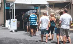  ??  ?? LINING UP: Council election prepolling at Cairns Showground­s.