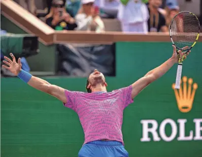  ?? ANDY ABEYTA/THE DESERT SUN ?? Carlos Alcaraz celebrates the match and championsh­ip point over Daniil Medvedev to win the ATP final of the BNP Paribas Open on Sunday in Indian Wells.