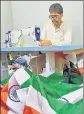  ?? AMAL KS/HT ?? A man sews a flag at a handloom house in Sadar Bazar.